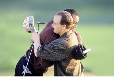 Bob May and Tiger Woods embrace after their battle at Valhalla in 2000