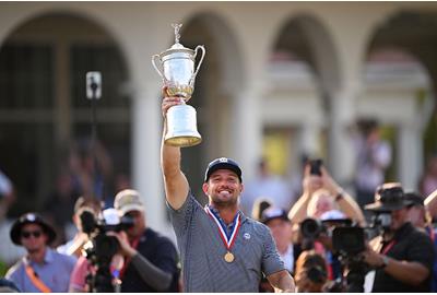 Bryson DeChambeau lifts the US Open trophy after his second major win