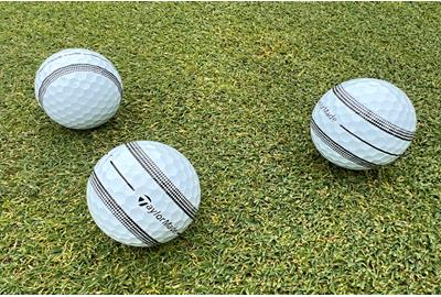 The TaylorMade TP5 and TP5x Stripe golf balls on a green.