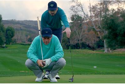 Sean Toulon and his Son, Preston, line up a putt with their new 2024 First Run Toulon Golf putter collection