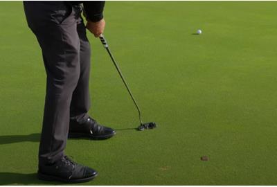 This major-winning golfer explains why he takes divots with his putter.