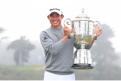 Collin Morikawa lifts the Wanamaker Trophy at TPC Harding Park.