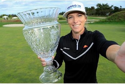 Golfer Mel Reid takes a selfie with the ShopRite LPGA Classic trophy.