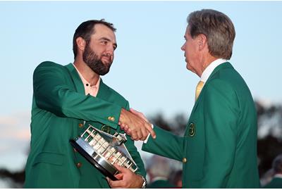 Scottie Scheffler is congratulated by Masters chairman Fred Ridley.